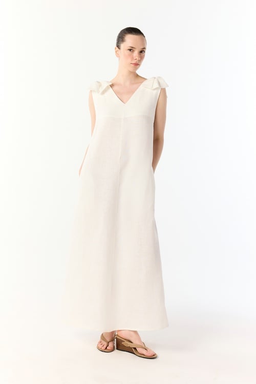  A KESİM CEPLİ KOLSUZ MİDİ ELBİSE